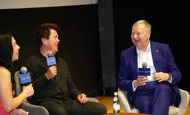 During a dialogue session, Winfried Engelbrecht-Bresges, CEO of The Hong Kong Jockey Club (right) and Simon Fuller, Founder of XIX Entertainment (centre), exchange views on how their partnership can showcase Hong Kong as a centre for global exchange, connectivity and tourism.