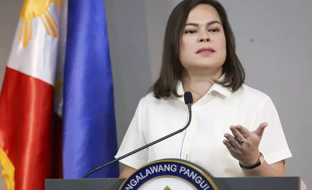 FILE - Philippine Vice President Sara Duterte gestures as she speaks during a press conference in Manila, Philippines on Feb. 7, 2025. (AP Photo/Basilio Sepe, File)