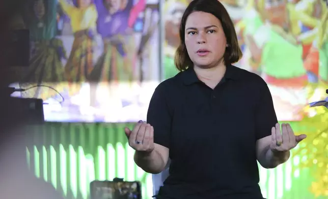 Philippine Vice President Sara Duterte gestures as she speaks to the media during a press conference after casting her vote at a polling center in Davao City, southern Philippines, Monday, May 12, 2025. (AP Photo/Manman Dejeto)