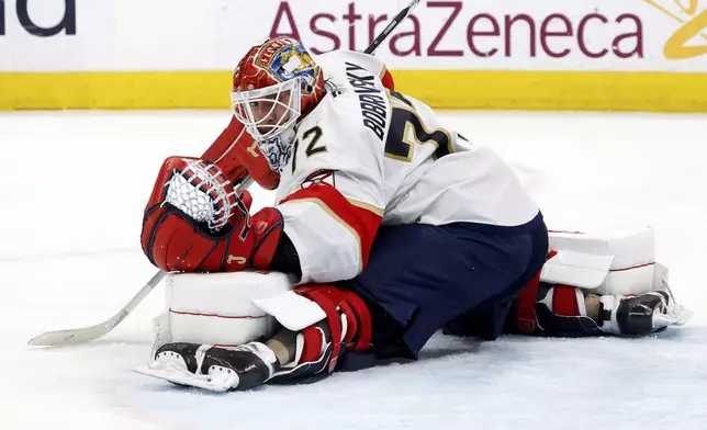 Florida Panthers goaltender Sergei Bobrovsky (72) blocks a shot by the Carolina Hurricanes during the second period of Game 1 of the NHL hockey Stanley Cup Eastern Conference finals in Raleigh, N.C., Tuesday, May 20, 2025. (AP Photo/Karl DeBlaker)
