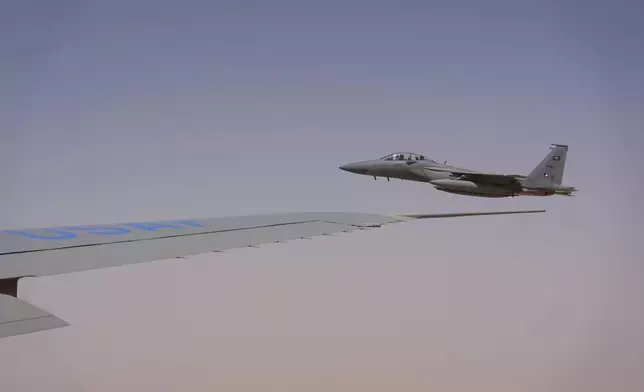 Royal Saudi Air Force F-15s provide an honorary escort for Air Force One, with President Donald Trump aboard, as it arrives in Saudi Arabia, Tuesday, May 13, 2025. (AP Photo/Alex Brandon)