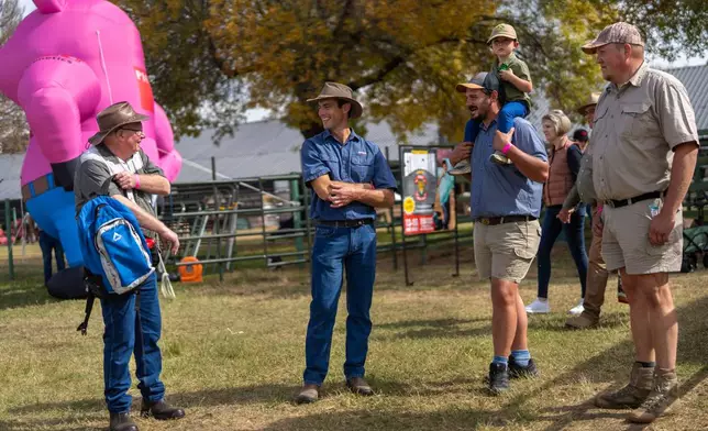 Farmers visit the Nampo agricultural fair, one of the largest in the southern hemisphere, near Bothaville, South Africa, May 15, 2025. (AP Photo/Jerome Delay)