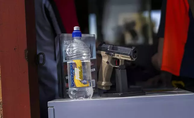 A hand gun from a retailer is on display at the Nampo agricultural fair, one of the largest in the southern hemisphere, near Bothaville, South Africa, May 15, 2025. (AP Photo/Jerome Delay)