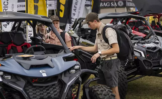 Tourists visit the Nampo agricultural fair, one of the largest in the southern hemisphere, near Bothaville, South Africa, May 15, 2025. (AP Photo/Jerome Delay)