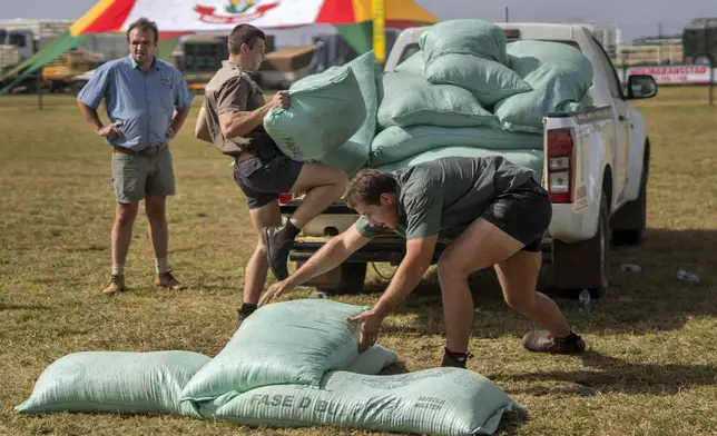 Farmers participate in a truck loading competition at the Nampo agricultural fair, one of the largest in the southern hemisphere, near Bothaville, South Africa, May 15, 2025. (AP Photo/Jerome Delay)