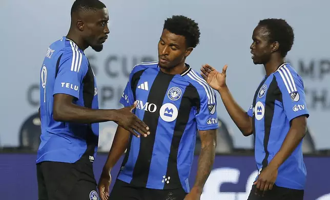CF Montreal's Prince Owusu, left, celebrates with teammates after his goal during an MLS soccer match against New York City FC, Saturday, May 10, 2025, in New York. (AP Photo/Andres Kudacki)