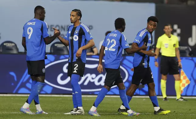 CF Montreal's Prince Owusu, left, celebrates with teammates after his goal during an MLS soccer match against New York City FC, Saturday, May 10, 2025, in New York. (AP Photo/Andres Kudacki)