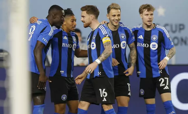 CF Montreal's Prince Owusu, left, celebrates with teammates after his goal during an MLS soccer match against New York City FC, Saturday, May 10, 2025, in New York. (AP Photo/Andres Kudacki)