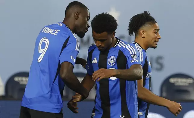 CF Montreal's Prince Owusu, left, celebrates his goal with team mates during an MLS soccer match against New York City FC on Saturday, May 10, 2025, in New York. (AP Photo/Andres Kudacki)