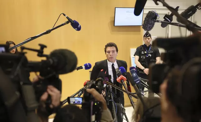 French actor Gerard Depardieu's lawyer Jeremie Assous speaks with the media after a verdict was delivered on accusations that the actor sexually assaulted two women who were working on a film with him in 2021, in Paris, Tuesday, May 13, 2025. (AP Photo/Thomas Padilla)