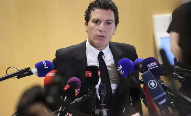 French actor Gerard Depardieu's lawyer Jeremie Assous speaks with the media after a verdict was delivered on accusations that the actor sexually assaulted two women who were working on a film with him in 2021, in Paris, Tuesday, May 13, 2025. (AP Photo/Thomas Padilla)