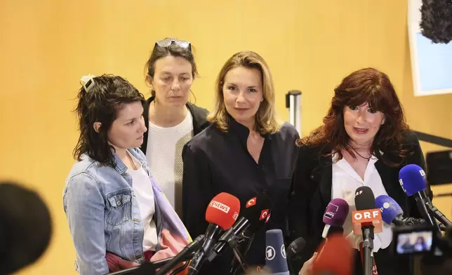 From left, a plaintiff's lawyer Claude Vincent, lawyer Catherine Le Magueresse, a plaintiff, a plaintiff's lawyer Carine Durrieu Diebolt speak with the media outside a Paris court, after a verdict was delivered on accusations that French actor Gerard Depardieu sexually assaulted two women who were working on a film with him in 2021, in Paris, Tuesday, May 13, 2025. (AP Photo/Thomas Padilla)
