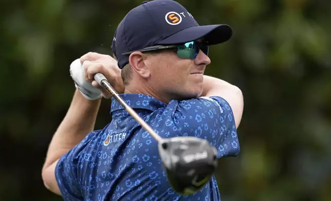 Rupe Taylor watches his tee shot on the 16th hole during a practice round for the PGA Championship golf tournament at the Quail Hollow Club, Monday, May 13, 2024, in Charlotte, N.C. (AP Photo/David J. Phillip)