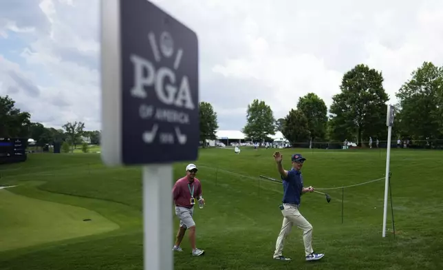 Rupe Taylor walks to the tee on the 16th hole during a practice round for the PGA Championship golf tournament at the Quail Hollow Club, Monday, May 13, 2024, in Charlotte, N.C. (AP Photo/David J. Phillip)