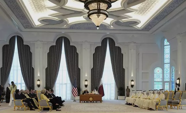President Donald Trump and Qatar's Emir Sheikh Tamim bin Hamad Al Thani sign documents during a signing ceremony at the Amiri Diwan in Doha, Qatar, Wednesday, May 14, 2025. (AP Photo/Alex Brandon)