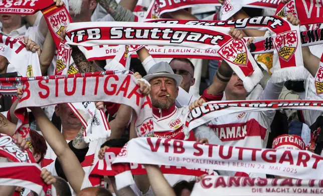 VfB Stuttgart fans cheer ahead of the German soccer cup, DFB Pokal, final match between Arminia Bielefeld and VfB Stuttgart at Olympiastadion in Berlin, Germany, Saturday, May 24, 2025. (AP Photo/Matthias Schrader)