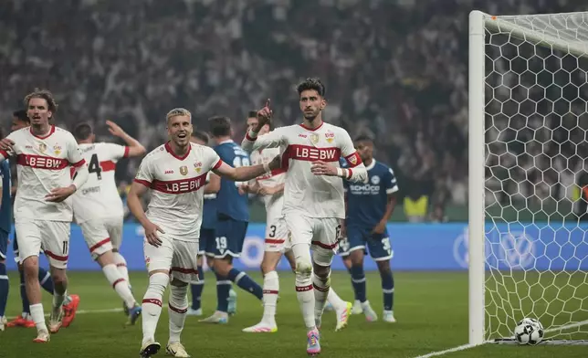 VfB Stuttgart players celebrate after Stuttgart's Enzo Millot scored his side's fourth goal during the German soccer cup, DFB Pokal, final match between Arminia Bielefeld and VfB Stuttgart at Olympiastadion in Berlin, Germany, Saturday, May 24, 2025. (AP Photo/Matthias Schrader)