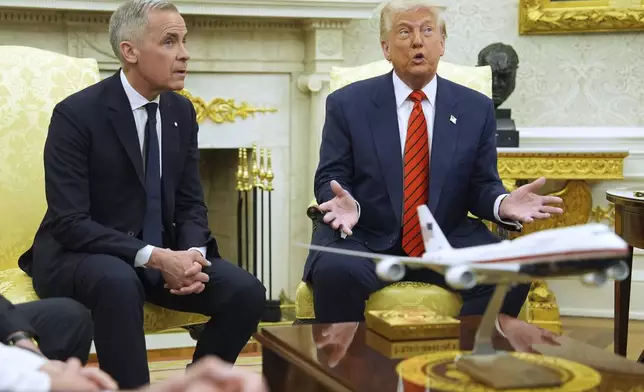 President Donald Trump meets Canadian Prime Minister Mark Carney in the Oval Office of the White House, Tuesday, May 6, 2025, in Washington. (AP Photo/Evan Vucci)