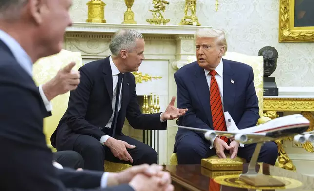 President Donald Trump meets Canadian Prime Minister Mark Carney in the Oval Office of the White House, Tuesday, May 6, 2025, in Washington. (AP Photo/Evan Vucci)