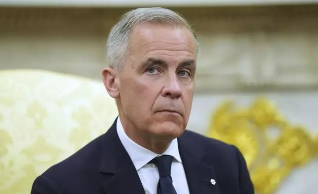 Canadian Prime Minister Mark Carney listtens to questions during a meeting with President Donald Trump in the Oval Office of the White House, Tuesday, May 6, 2025, in Washington. (AP Photo/Evan Vucci)
