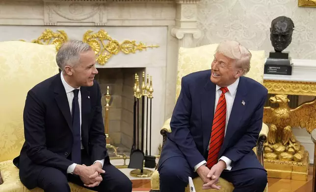 Canada Prime Minister Mark Carney and U.S. President Donald Trump engage in a meeting at the White House in Washington, Tuesday, May 6, 2025. (Adrian Wyld/The Canadian Press via AP)