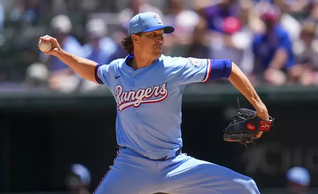 Texas Rangers pitcher Jacob deGrom throws a pitch to the Seattle Mariners during the first inning of a baseball game Sunday, May 4, 2025, in Arlington, Texas. (AP Photo/Julio Cortez)