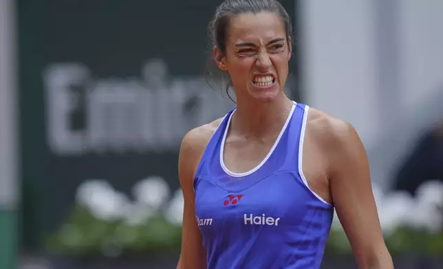 France's Caroline Garcia reacts as she plays United States' Bernarda Pera during their first round match of the French Tennis Open, at the Roland-Garros stadium, in Paris, Monday, May 26, 2025. (AP Photo/Thibault Camus)