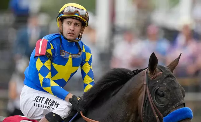 Flavien Prat, atop Goal Oriented, looks on after participating in the 150th running of the Preakness Stakes horse race Saturday, May 17, 2025, at Pimlico Race Course in Baltimore. (AP Photo/Stephanie Scarbrough)