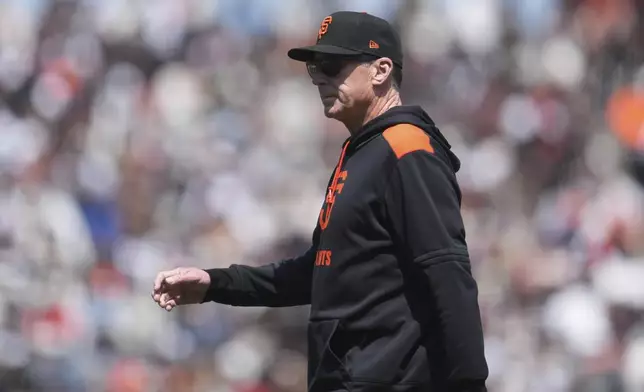 San Francisco Giants manager Bob Melvin walks to the dugout after making a pitching change during the sixth inning of a baseball game against the Colorado Rockies in San Francisco, Saturday, May 3, 2025. (AP Photo/Jeff Chiu)