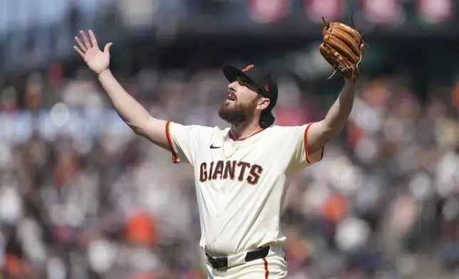 San Francisco Giants pitcher Ryan Walker celebrates after a baseball game against the Colorado Rockies in San Francisco, Saturday, May 3, 2025. (AP Photo/Jeff Chiu)