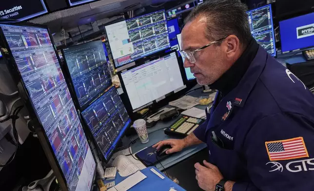 Specialist Anthony Matesic works on the floor of the New York Stock Exchange, Tuesday, May 27, 2025. (AP Photo/Richard Drew)
