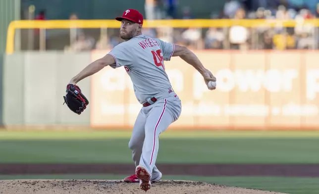 Philadelphia Phillies pitcher Zack Wheeler throws to the Athletics during the second inning of a baseball game Friday, May 23, 2025, in West Sacramento, Calif. (AP Photo/Sara Nevis)