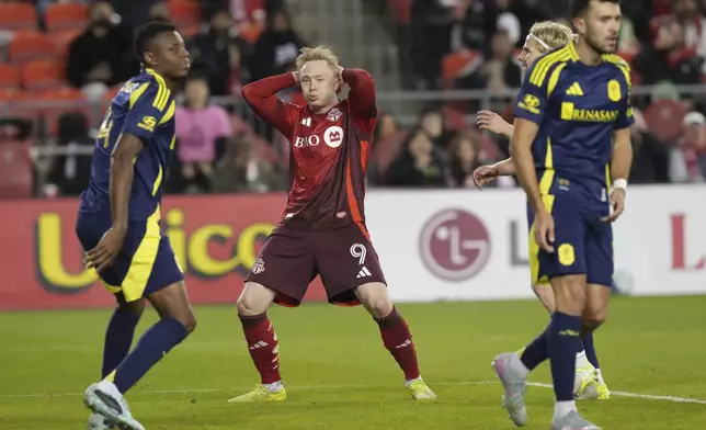 Toronto FC's Ola Brynhildsen (9) reacts after missing a goal-scoring opportunity against SC Nashville during second-half MLS soccer match action in Toronto, Saturday, May 24, 2025. (Chris Young/The Canadian Press via AP)