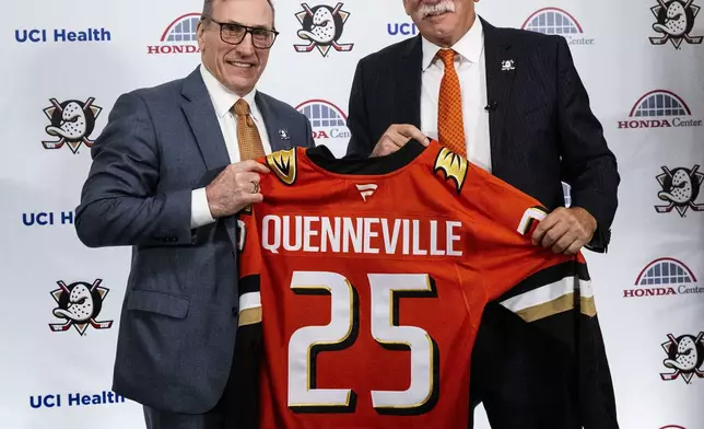 Anaheim Ducks general manager Pat Verbeek, left, and new head coach Joel Quenneville pose with jersey during an NHL hockey press conference in Anaheim, Calif., Thursday, May 8, 2025. (Paul Bersebach/The Orange County Register via AP)