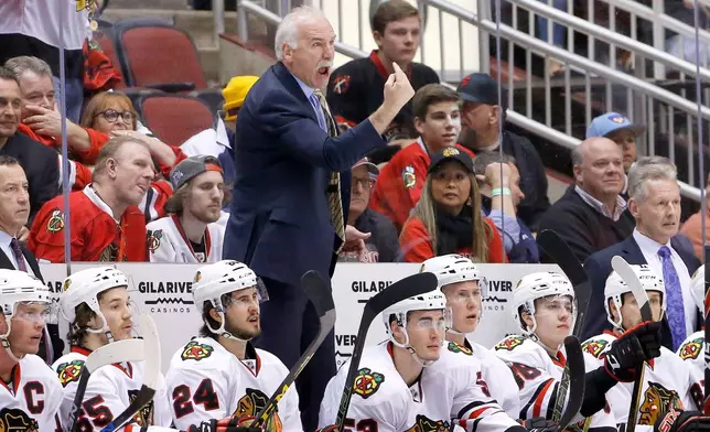 FILE - Chicago Blackhawks' Joel Quenneville stands on the team bench as he argues with officials during the first period of an NHL hockey game against the Arizona Coyotes Thursday, Feb. 4, 2016, in Glendale, Ariz. (AP Photo/Ross D. Franklin, File)