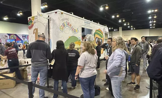 Berkshire Hathaway shareholders line up Friday, May 2, 2025 for the chance to buy Warren Buffett and Charlie Munger Squishmallows in Omaha, Neb. (AP Photo/Josh Funk)