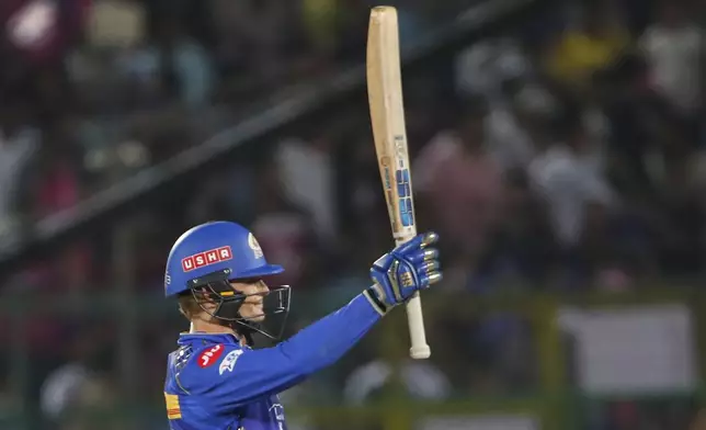 Mumbai Indians' Ryan Rickelton celebrates after scoring fifty runs during the Indian Premier League cricket match between Rajasthan Royals and Mumbai Indians at Sawai Mansingh Stadium in Jaipur, India, Thursday, May 1, 2025. (AP Photo/Surjeet Yadav)