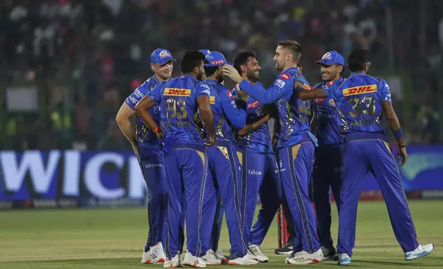 Mumbai Indians celebrates the dismissal of Rajasthan Royals' Vaibhav Suryavanshi rduring the Indian Premier League cricket match between Rajasthan Royals and Mumbai Indians at Sawai Mansingh Stadium in Jaipur, India, Thursday, May 1, 2025. (AP Photo/Surjeet Yadav)