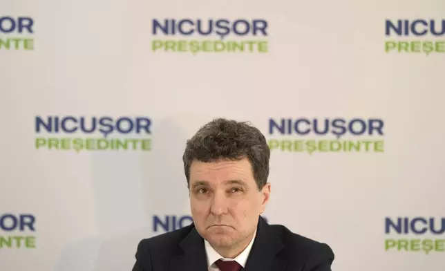 Presidential candidate Nicusor Dan looks up during a press conference in Bucharest, Romania, Thursday, May 1, 2025. (AP Photo/Vadim Ghirda)