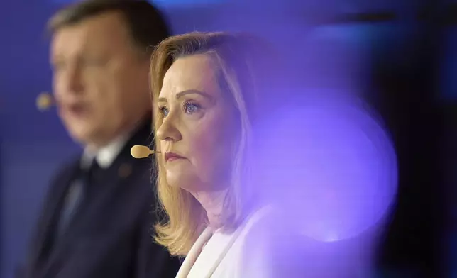 Presidential Candidate ELena Lasconi listens to questions during a live electoral debate in Bucharest, Romania, Monday, April 28, 2025. (AP Photo/Vadim Ghirda)
