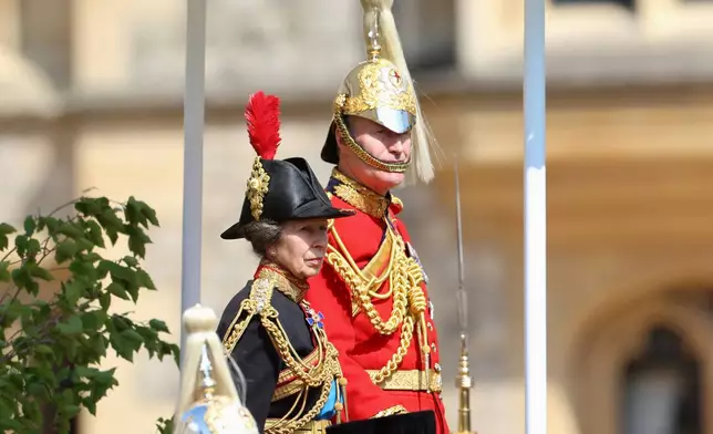 Britain's Princess Anne and Lieutenant General Sir Edward Smyth-Osbourne, Colonel, The Life Guards watch the presentation of the New Standards at Windsor Castle, Windsor, England, Monday May 12, 2025. (Chris Jackson/Pool via AP)