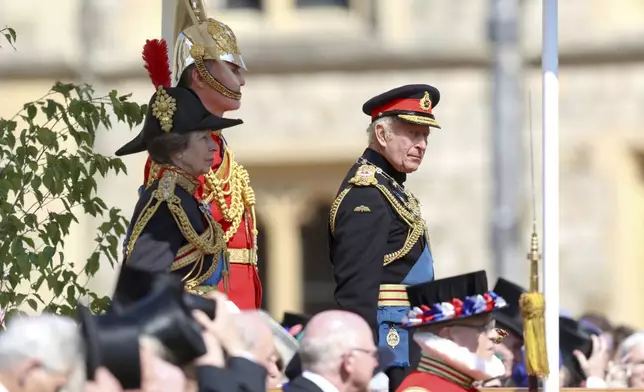 Britain's King Charles III and Princess Anne inspect the parade at the presentation of the New Standards at Windsor Castle, Windsor, England, Monday May 12, 2025. (Chris Jackson/Pool via AP)