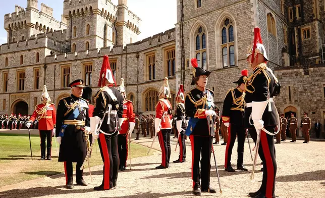 Britain's King Charles III, left, and Princess Anne attend the presentation of the New Standards at Windsor Castle, Windsor, England, Monday May 12, 2025. (Aaron Chown/Pool via AP)