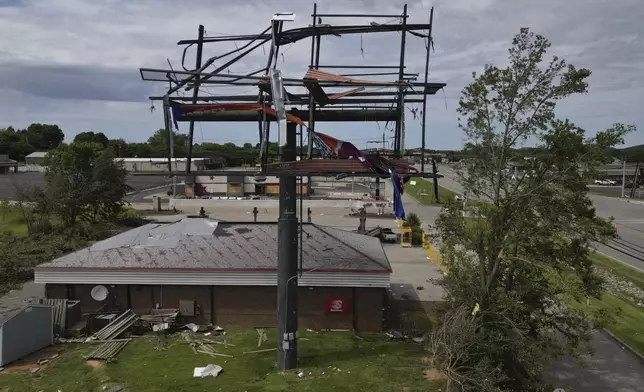 A billboard and Speedway gas station are damaged, Sunday, May 18, 2025, along Highway 27 in Somerset, Ky., after a severe storm passed through the area. (AP Photo/Carolyn Kaster)