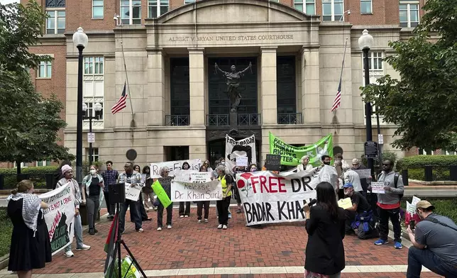 Pro-Palestinian protestors call for the release of Georgetown University scholar Badar Khan Suri, during a hearing for his case at the Federal District Court of the Eastern District of Virginia, in Alexandria, Va., Wednesday, May 1, 2025 (AP Photo/Nathan Ellgren)