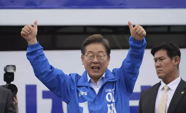 South Korea's Democratic Party's presidential candidate Lee Jae-myung greets supporters during a presidential election campaign in Goyang, South Korea, Tuesday, May 20, 2025. (AP Photo/Lee Jin-man)