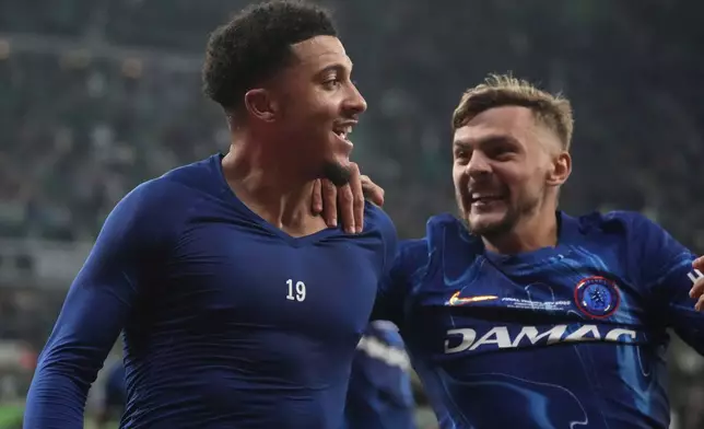 Chelsea's Jadon Sancho, left, celebrates after scoring his side's third goal during the Europa Conference League final soccer match between Real Betis and Chelsea in Wroclaw, Poland, Wednesday, May 28, 2025. (AP Photo/Czarek Sokolowski)