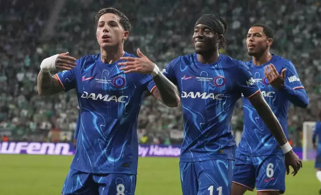 Chelsea's Enzo Fernandez, left, celebrates after scoring his side's opening goal during the Europa Conference League final soccer match between Real Betis and Chelsea in Wroclaw, Poland, Wednesday, May 28, 2025. (AP Photo/Czarek Sokolowski)
