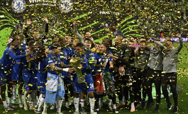 Chelsea players celebrate with the trophy after the Europa Conference League final soccer match between Real Betis and Chelsea in Wroclaw, Poland, Wednesday, May 28, 2025. (AP Photo/Denes Erdos)