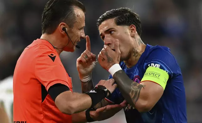Chelsea's Enzo Fernandez, right, argues to referee Irfan Peljto during the the Europa Conference League final soccer match between Real Betis and Chelsea in Wroclaw, Poland, Wednesday, May 28, 2025. (AP Photo/Denes Erdos)